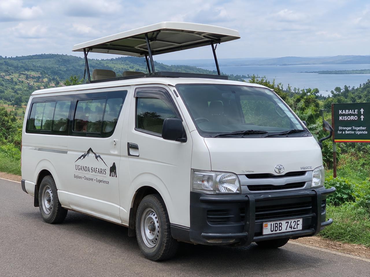 Toyota safari van with pop-up roof on a road in south-western Uganda